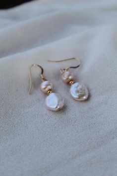 Handmade with 14k gold filled materials, a champagne/peach fresh water pearl and traditional white fresh water pearl. Pearls are associated with commitment, feminine energy and inner wisdom. Cream Pearl Drop Jewelry As A Gift, Elegant Everyday Cream Jewelry, Anniversary 14k Gold Filled Pearl Drop Earrings, Pearl White Pearl Drop 14k Gold Filled Earrings, Delicate Cream Jewelry With Pearl Drop, Cream Pearl Drop Jewelry For Anniversary, Rose Gold Pearl Drop Earrings 14k Gold Filled, Rose Gold 14k Jewelry With Pearl Drop, 14k Rose Gold Jewelry With Pearl Drop