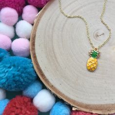 "This is Piney the Pineapple Necklace! This fun little piece comes on a 16\" gold plated chain. Message us if you want a different length! Need matching earrings? We have those in the shop too! - Enamel Pendant - Gold Plated Necklace and clasp This Necklace is custom made to your preferences and will be ready to ship within 3-5 days. Follow us on Instagram (@littlebabegems) to see shop updates and our current sales! WARNING This item contains small parts that could cause choking and is not inten Cute Gold Dangle Jewelry, Cute Gold Pendant Jewelry, Cute Gold Pendant Necklace, Fun Yellow Jewelry For Birthday, Cute Gold Dangle Necklaces, Cute Handmade Gold Charm Necklaces, Handmade Cute Gold Charm Necklaces, Fun Jewelry With Adjustable Chain For Gifts, Cute Gold Necklace With Adjustable Chain