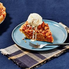 a slice of pie on a plate with ice cream in the bowl next to it