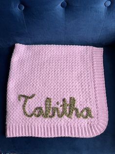 a crocheted blanket with the word fahlha written on it