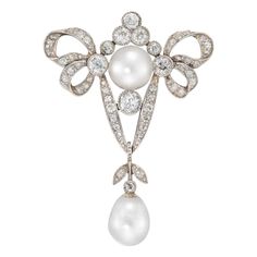 A late Victorian pearl and diamond brooch, the brooch with a diamond-set ribbon bow surmount, set to the centre with a pearl and diamond cluster, the pearl measuring approximately 8 mm in diameter, dropping a natural pear-shaped pearl measuring approximately 9.6 x 7.6 mm from a V-shaped diamond run and rose-cut diamond-set foliate motif, all old brilliant-cut diamonds estimated to weigh a total of 1.60 carats, all set in silver to a yellow gold mount and brooch fitting, circa 1890, measuring app Art Deco Brooch, Diamond Bows, Bow Brooch, Bow Jewelry, Diamond Brooch, Pearl Brooch, Silver Brooch, Van Cleef, Lovely Jewellery