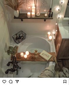 a bath tub with candles and books on it