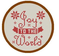 a cross stitch ornament with the words joy to the world in red and white