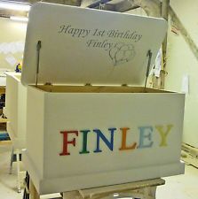 a white box with the word finnley painted on it's side sitting in a workshop