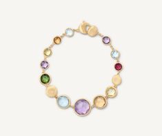 The most precious of our Jaipur bracelets, this jewel features graduated curb of mixed gemstones, embellished by 18K yellow gold bezel settings finely hand-engraved using the ancient Florentine technique.