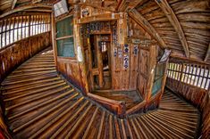 the inside of a wooden structure with bars and windows