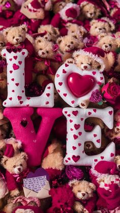 the word love spelled out in letters surrounded by teddy bears and roses with hearts on them