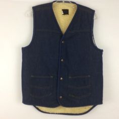 "This is a vintage Sears Roebuck Sherpa Lined Denim Vest.  The tag says it is a size medium 38-40 tall.  See the measurements below.   This would be perfect to wear to all of your outdoor fall or winter festivities.  It is warm with it's sherpa lining and has such a classic western look to it.  My uncle used to wear one just like this and he was (in my eyes) the ultimate cowboy!  He even used to barrel race and won quite a few blue ribbons.  Oh the memories this vest brings back! It is in good v Winter Medium Wash Washed Denim Vest, Medium Wash Denim Vest For Winter, Fitted Winter Denim Vest With Pockets, Winter Fitted Denim Vest With Pockets, Fitted Denim Vest With Pockets For Winter, Winter Dark Wash Cotton Denim Vest, Fitted Denim Vest In Dark Wash For Winter, Fitted Dark Wash Denim Vest For Winter, Vintage Denim Vest In Medium Wash For Winter