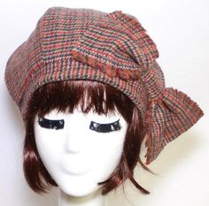 That Girl hat is made from Rust multi color herringbone wool, wool bow may vary, lined in black taffeta, the top of the hat is made up of 6 section crown, wool bias 1" fitted band and has a elastic band inside. That Girl hat fits comfortably on your head as a chic beret. One size fits all and will fit up to a 22" head size or customized size upon request. All of Bella Starr hats are made and designed from my original patterns. Caring for your hat: Dry clean only Fitted Wool Cap, Fitted Wool Cloche Hat For Fall, Fitted Brimmed Hat With Bow, Fitted Felt Cap For Fall, Fitted Fall Felt Cap, Fitted Wool Top Hat For Fall, Fall Fitted Wool Top Hat, Fitted Hat With Bow And Curved Brim, Fitted Wool Fedora Mini Hat