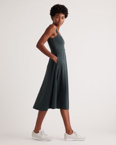 The definition of effortlessly cool, our fit and flare style is as easy to wear as it is fashionable. The midi length and pockets are designed to flatter every shape while the lightweight blend of recycled polyester and a touch of spandex feels buttery soft. Not to mention its moisture-wicking properties and 4-way stretch leave you feeling extra comfortable. Trust us, you’re going to want to wear this dress everywhere you go.  | Quince | Women's Flowknit Breeze Fit & Flare Dress in Heather Green Casual Midi Dress With Flattering Silhouette For Work, Casual Solid Dress With 4-way Stretch, Fitted Midi Dress With Side Pockets, Casual Fit And Flare Mid-length Midi Dress, Relaxed Fit Midi Dress With Slip Pockets, Casual Fit And Flare Midi Dress, Heather Green, Mink Pink, Athletic Wear