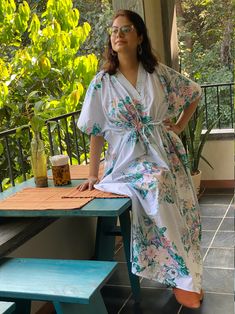 I made this Kaftan from a beautiful floral pattern in 100% mulmul cotton. Mulmul is a very fine variety of cotton which is extremely soft and it gets softer with every wash. It is so free flowing, that it will make you feel as if you aren't wearing anything at all ;) The beauty of the Kaftans is they will fit everyone so no need to worry about the size et all. All my Kaftans have deep necks(11-12 inches) so will fit all head sizes. However, the length of my kaftans will vary. I make all my kafta Floral Print Sleepwear With Kimono Sleeves, White Floral Print Sleepwear For Vacation, Floral Print Kaftan For Spring Loungewear, Spring Floral Print Kaftan For Loungewear, Cotton Floral Print Robe For Daywear, Spring Cotton Robe With Floral Print, Summer Floral Print Robe, White Floral Print Kimono For Loungewear, Bohemian Cotton Floral Print Robe