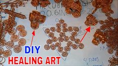 an art project with lots of copper colored beads and words that read diy heating art