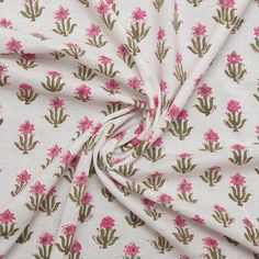 a white fabric with pink flowers on it