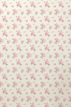 a pink flowered wallpaper with small flowers on it's side and green leaves