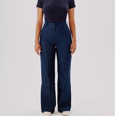 High-Waisted, With A Straight Leg Fit, These Pants Have A Slimming Effect Enhanced By Elongating Front Seams Extending From Thigh To Ankle. A Double Hook And Bar Closure With An Interior Button Provide A Clean Finish In The Front, While The Back Is Fit To Provide Lift And Shape. Our Denim Is Made From Organic Cotton Processed In A Gots-Certified Italian Mill. We’ve Invested In Working With A Responsible Denim Mill That Measures Their Impact And Uses Data To Push The Industry Forward. They’ve Dev Relaxed Fit Denim Blue Flare Jeans For Work, Fitted Dark Wash Wide Leg Flare Jeans, High Waist Fitted Dark Wash Flare Jeans, Cotton High-waisted Flare Jeans For Work, Fitted High Waist Dark Wash Flare Jeans, Fitted High Rise Denim Blue Bottoms, Chic Denim Workwear Bottoms, Fitted High-rise Denim Bottoms, Fitted High-rise Denim Flare Jeans