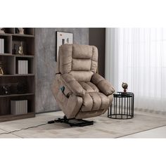 a large recliner chair sitting in front of a book shelf