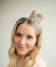 PALE GOLD Glitter Crown, ROSE velvet Trim with WHITE glitter number Our party hats and crowns are attached to a comfortable elastic and meant to be worn around the back of the head, behind the ears. Tilt to the side for a fun, whimsical look! LITTLE BLUE OLIVE SHOP CROWNS and HATS are the perfect accessory for birthday celebrations, memorable photo shoots and every day fun for dress up. Hats are hand crafted of a high quality, non-shed glitter. Dirty Thirty Party, Olive Crown, Thirty Birthday, Designer Headbands, Rose Crown, Glitter Crown, Rose Velvet, Birthday Party Hats, Plastic Headband