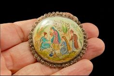 "This is a very beautiful, old and unique ASIAN HAND PAINTED MOTHER OF PEARL SILVER c. 1920 pin brooch. The pin has hand painted scene on mother of pearl and silver. It measures 1 1/2\". The pin is in good condition. 0.7 AOJEPC-802-98" Traditional Round Collectible Brooches, Traditional Collectible Round Brooches, Handmade Antique Enamel Pin For Gift, Handmade Silver Enamel Pin Collectible, Handmade Silver Enamel Pin For Collectors, Yellow Gold Jewelry With Mother Of Pearl, Round Shape, Antique Enamel Handmade Brooches, Mother Of Pearl Cufflinks, Vintage Multi-stone Gold Brooches