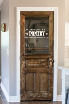 a wooden door with the words wood's family & co pantry on it