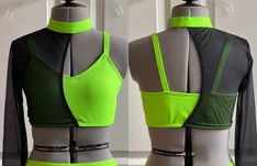 two mannequins wearing green and black tops