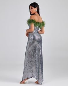 Give your evening look an alluring sparkle with the Off Shoulder Feather Sequin Maxi Dress. A sophisticated piece with an off the shoulder neckline and glittering sequins, this dress is perfect for making a statement. Its luxurious feather pattern seamlessly blends the design with a hint of glamour. Let its subtle drama and artful transitions of light put you in the limelight. Our Style No.SJ081513 Bead Piece & Feather Height - 66.9"/170cm Bust - 33.8"/86cm Waist - 24.4"/62cm Hips - 36.2"/92cm a Sequin Maxi Dress, Sequin Maxi, Feather Pattern, Silver Dress, Blue Jacket, Off The Shoulder, Off Shoulder, Sequin, Drama