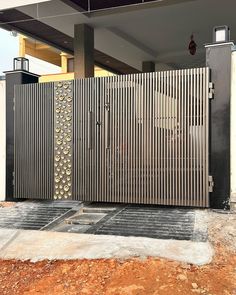 a large metal gate in front of a house