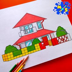 a drawing of a house on paper with colored pencils next to it and an orange background