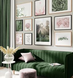 a living room with green velvet couches and pictures on the wall above them in various frames