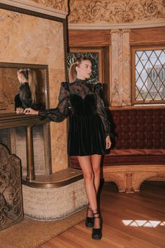 This playful mini dress features a cut out in the back for added allure, while the bodice's boning provides a flattering fit. Tied with a bow in the back of the neck, this spell on you dress is perfect for a night out. With long sheer sleeves and elastic cuffs, it adds the perfect touch of edginess to your wardrobe. Details Black mini dress Cut out in back Boning in bodice Tied bow in back of neck Long sheer sleeves Elastic in cuffs Velvet bodice Invisible zipper Fully lined Wired and padded cup Nursing Friendly Tops, Free People Sandals, Nursing Friendly Dress, Plus Swim, Plus Jumpsuit, Exclusive Dress, Black Mini Dress, Basic Dress, Maternity Shops