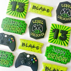 decorated cookies with video game controllers and happy birthday messages for someone's 13th birthday