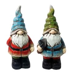 two garden gnomes standing next to each other