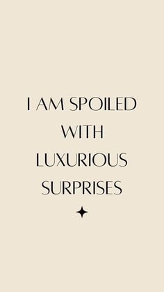 the words i am spoiled with luxurious surprises written in black on a beige background