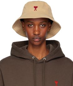 Cotton gabardine bucket hat in beige. · Logo embroidered at face · Quilted brim · Twill browband · Plain-woven lining Supplier color: Sand Paris Hat, Paris Woman, Ami Paris, Color Sand, Logo Embroidered, Hats For Women, Apparel Accessories, Bucket Hat, Accessories Hats