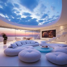 a living room filled with white furniture and a skylight above the couches in front of a flat screen tv