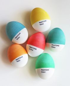 four different colored eggs with labels on them