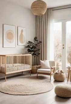 a baby's room with a crib, chair and rug