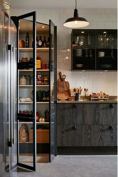 a kitchen with lots of shelves and cupboards