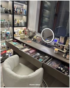 a chair sitting in front of a mirror on top of a desk next to a counter