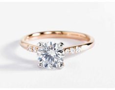 a diamond engagement ring on a white background