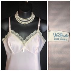 "Here I have a lovely pale pink full slip with scalloped lace accent on the yoke and hemline. There are adjustable satin shoulder straps with metal hardware as well. Made of Dupont nylon, there is no \"give\" to the fabric so be sure of your measurements. A crisp tag on the inside, new/old stock, never worn. I see one tiny, very minor, storage dot on the front, barely visible unless you look for it. The bust is 32\", waist 28\", hips 33\", length as shown is 31\"." Vintage Pink Fitted Camisole, Pink Fitted Vintage Camisole, Vintage Lace Trim Camisole For Spring, Vintage Camisole With Lace Trim For Wedding, Vintage Wedding Camisole With Lace Trim, Peignoir Sets, Lace Bands, Rose Pale, Sheer Chiffon