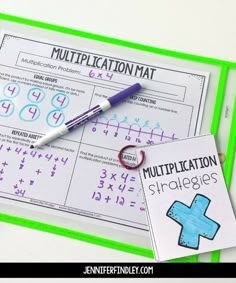 two worksheets for addition and subtraction with a pen next to them