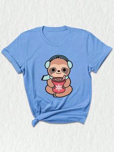 a blue t - shirt with a cartoon monkey holding a donut and wearing headphones