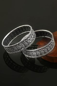 92.5 sterling silver toned oxidized pair of kada bangles with floral carvings. Components: Set of 2 Composition: 92.5 Sterling Silver Color: Silver Other Details:  Handcrafted Slip-on style Dimensions: L x W (in cms): 2.4 x 2.4 Weight (in gms): 40  - Aza Fashions Kada Bangles, Jewellery Bangles, Bangles Silver, Diamond Pendant Sets, Pendant Sets, Indian Jewelry Sets, Wedding With Kids, Bangle Set, Bangles Jewelry