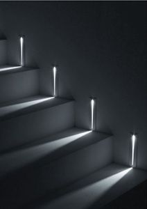 the light is shining down on some stairs with lights coming in from them and onto the floor