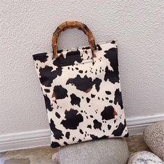 Cow Print Mini Tote Bag Faux Leather Handbag 14' X 12" Cow Print Shopper Tote Bag Faux Leather The Cow Print Shopper Style Tote Bag Is A Multi-Functional Tote Handbag. The Shopper Bag Is A Fantastic Handbag For Style And Functionality, Whether You Need To Carry A Change Of Shoes, Or Want To Have Easy Access To Your Keys, Your Makeup, Carry Your Laptop, You Name It The Brown Cow Print Pattern On A Beige Background Looks Every Elegant. Dimensions: 14" Tall X 12" Wide. Lined Inside One Main Zippere Trendy Cow Print Bags For Everyday Use, Rectangular Cow Print Travel Bag, Black Bag With Cow Print For Everyday Use, Cow Print Leather Bag For Daily Use, Leather Cow Print Bag For Everyday Use, Casual Everyday Bag With Cow Print, Brown Cow Print Bag For Everyday Use, Casual Cow Print Bags For Daily Use, Brown Cow Print Bag