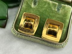 "A pair of vintage gold tone costume jewelry buckle earrings. They have clip backs. No marks. They measure about .83\" long and .72\" at the widest. Lots of wear to the finish. Actual packaging will vary depending on item/s purchased and tape pattern available. Props/boxes shown in photos are for display purposes only, not included in this listing. As always, satisfaction is guaranteed. Thanks for shopping Vintage In Bloom! More earrings: http://www.etsy.com/shop/VintageInBloom?section_id=122008 Retro Brass Earrings For Formal Occasions, Gold-tone Brass Clip-on Earrings For Formal Occasions, Vintage Gold-tone Earrings, Retro Gold Brass Earrings, Vintage Gold Clip-on Jewelry, Gold Clip-on Classic Plug Earrings, Retro Yellow Gold Formal Earrings, Retro Gold Clip-on Earrings For Anniversary, Vintage Yellow Gold Clip-on Earrings