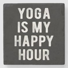 yoga is my happy hour slate coaster with white lettering on grey background, featuring the words'yoga is my happy hour '