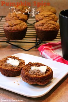 two muffins on a plate with cream cheese