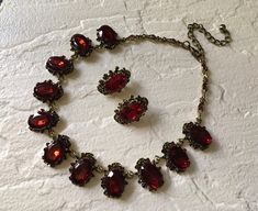 "Victorian shaped antiqued brass red glass stones necklace design just perfect to wear on your wedding day! We have added an extra long cable chain for you to adjust the length. Color: antiqued brass with red rhinestones crystals and glass stones Size: sparkle part measures around 15\" long x 0.9\" width ** Please note we need to take around 5 days to make it. Please be patient. ** Item ship out with tracking number to you (around 10 to 14 business days for delivery). We also provide fast shippi Red Garnet Necklace, Bronze Wedding, 1950s Jewelry, Stones Necklace, Wedding Red, Ruby Wedding, Victorian Wedding, Fancy Wedding, Necklace Bridal