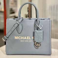 Brand New With Tag Michael Kors Mirella Leather Small Shopper Top Zip Crossbody Outlet Style Pebble Leather Silver Tone Hardware 9.25"W X7.75"H X 3.75"D Handle Drop: 3.25" Adjustable Strap: 20.25"-23.75" Interior Details: Back Zip Pocket, Front Slip Pocket Lining: 100% Polyester Zip Fastening Imported Blue Double Handle Shoulder Bag With Logo, Blue Shoulder Bag With Logo And Double Handles, Michael Kors Evening Bag With Logo, Luxury Silver Bags With Logo, Blue Leather Bags With Logo, Luxury Blue Shoulder Bag With Logo, Blue Top Handle Shoulder Bag With Logo, Blue Top Handle Bag With Logo, Michael Kors Luxury Silver Shoulder Bag